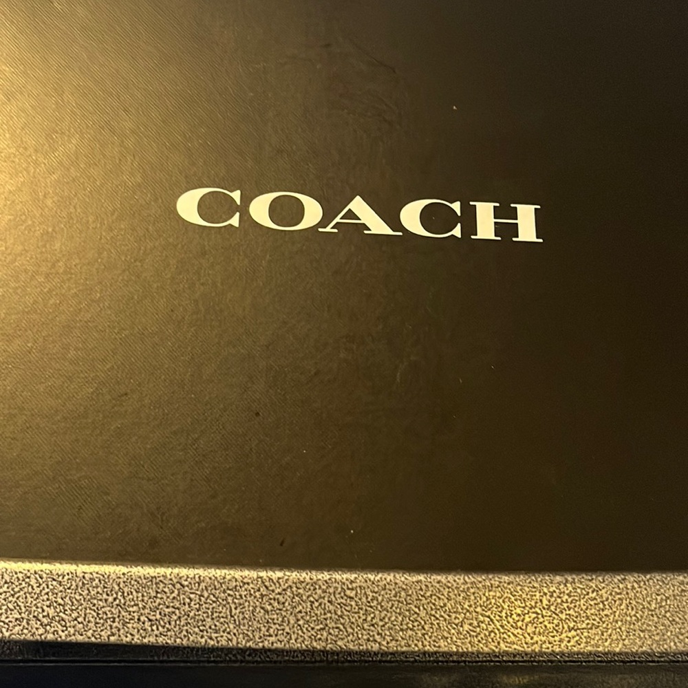 Coach size 9 stylish high top sneakers.